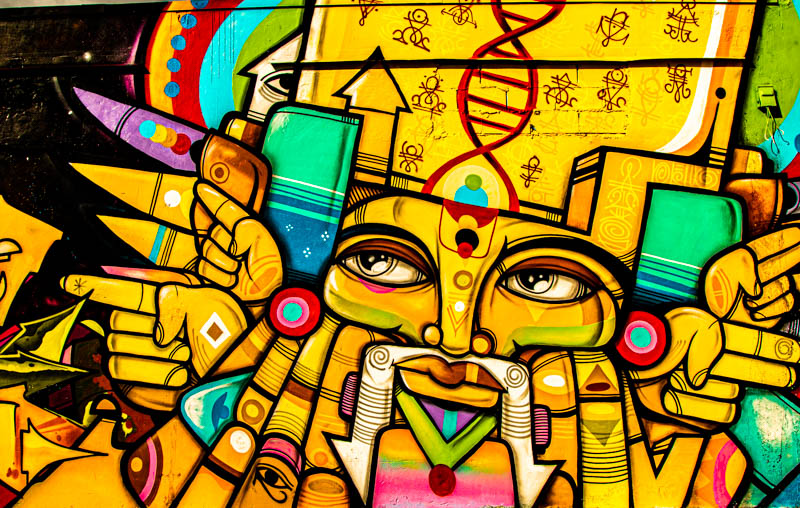 Abstract geometric mural in electric blue and yellow